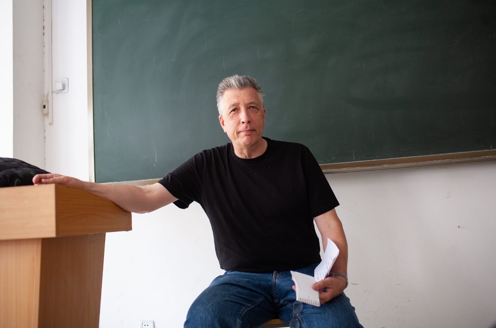 Tracy Dahlby sits in a classroom at a university in Shanghai during a Reporting China Maymester. Dahlby will retire from the School of Journalism and Media following the Spring 2022 semester.