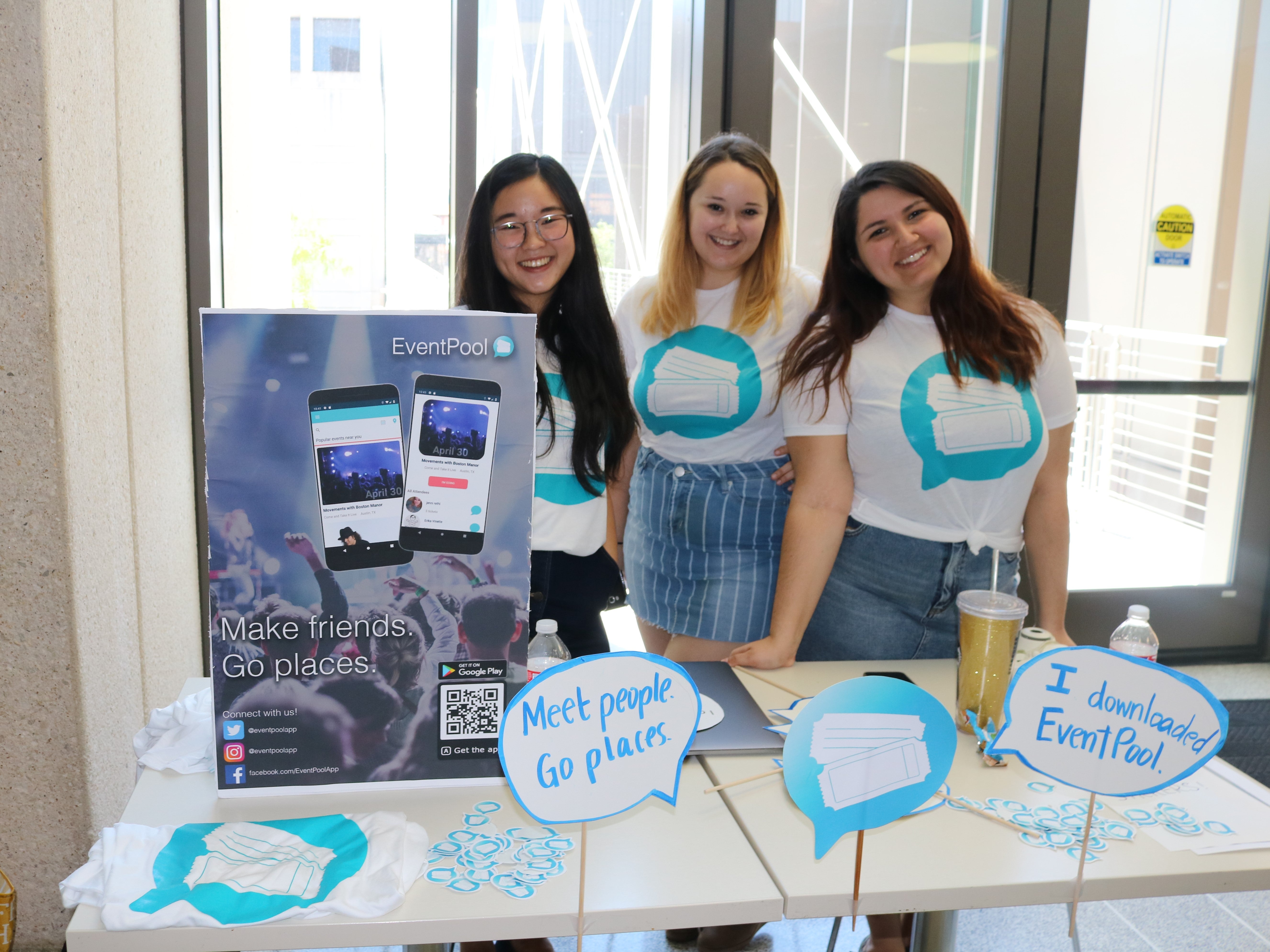 Student team for Event Pool poses by their presentation table