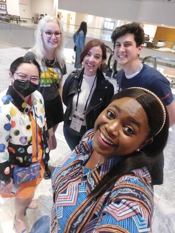 Five Students look at the camera for a selfie