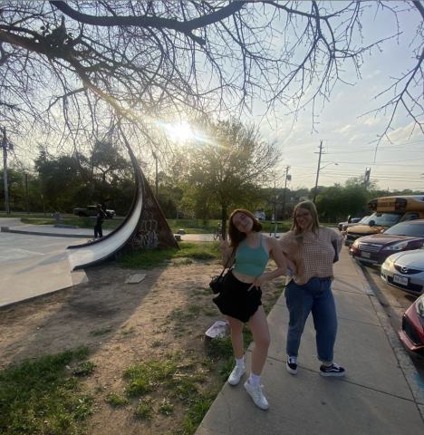 students posing in front of skatepark