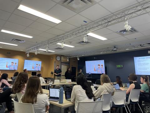 students watching class project presentation