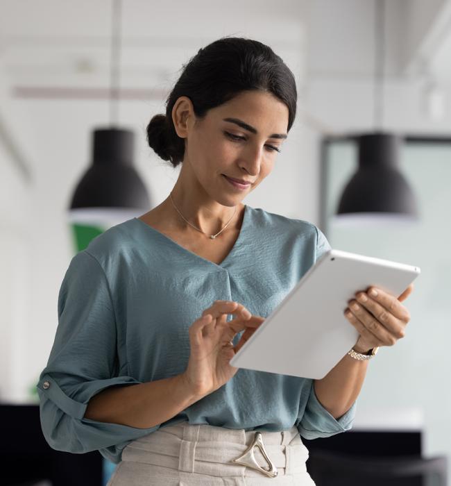 professional woman working at an iPad