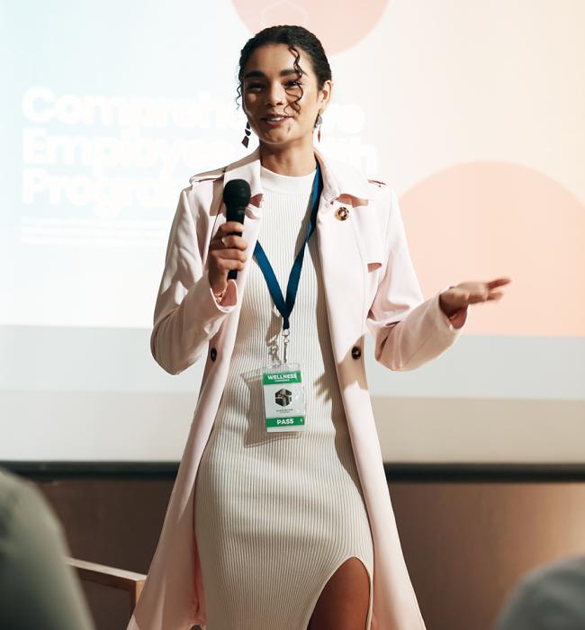 professional woman presenting to an off-camera group