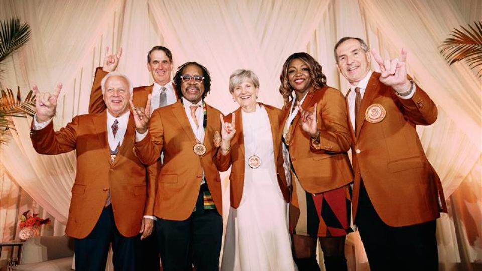 A group of winners at the Texas Exes Distinguished Alumnus Awards presentation event. Fran Harris is second from right.