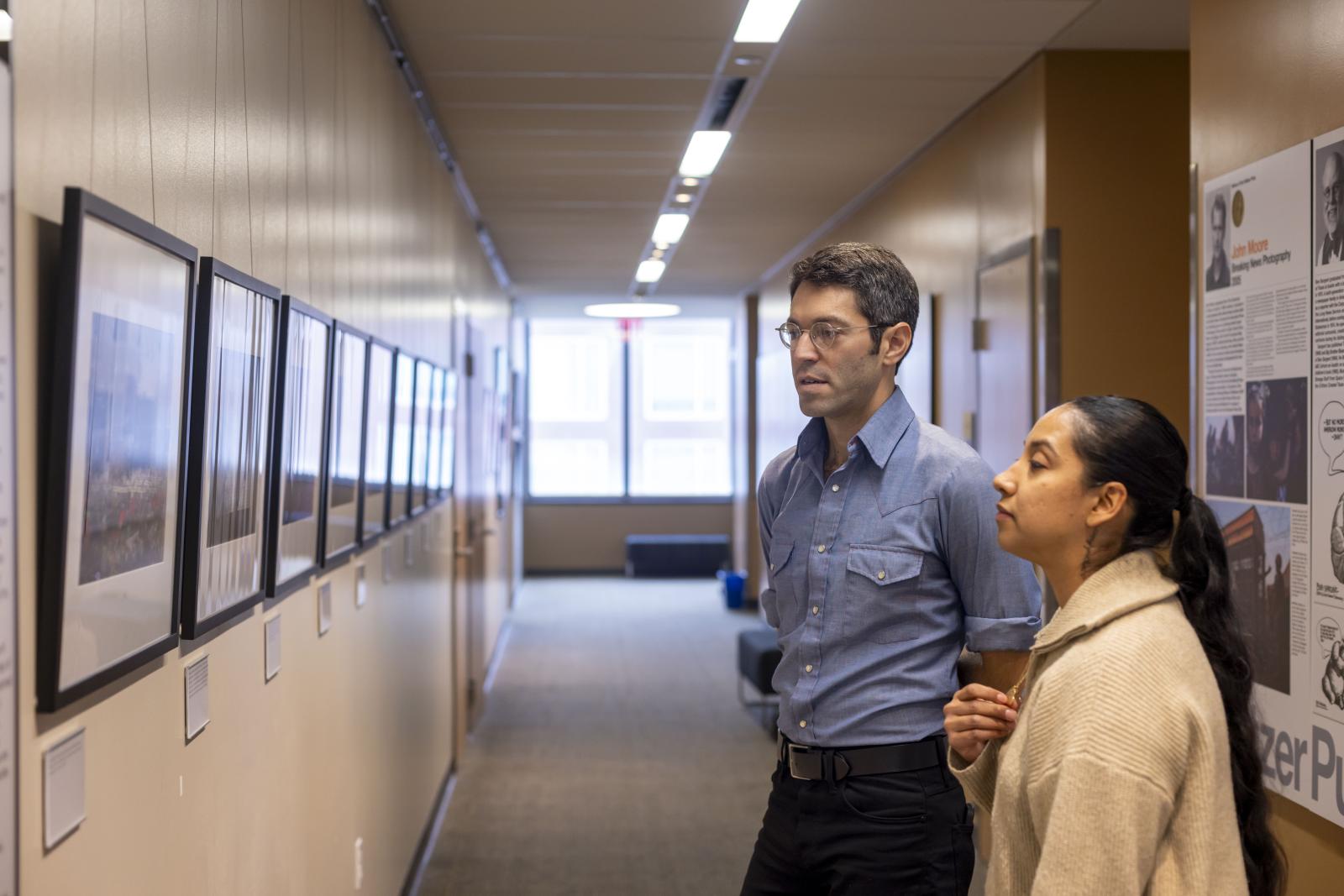 Tamir Ben Kalifa and Kimberly Mata-Rubio view Kalifa's photos from the school shooting in Uvalde, TX
