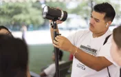 student with camera