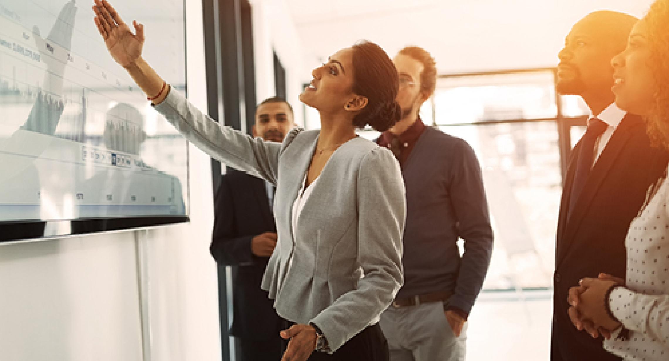 Group of professionals working at a whiteboard