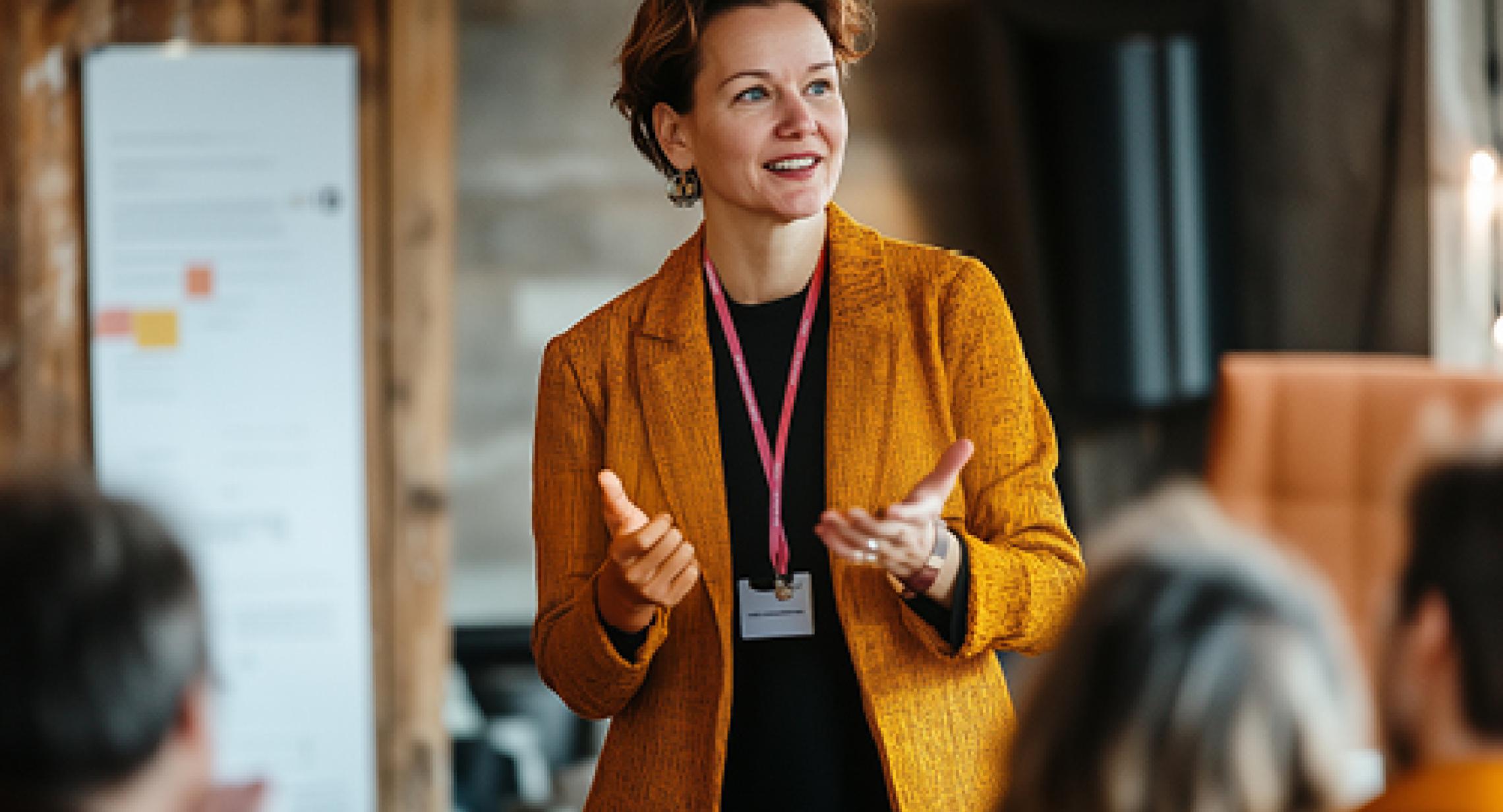 Professional woman presenting to a group