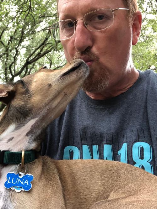 Christian McDonald holds his dog, Luna